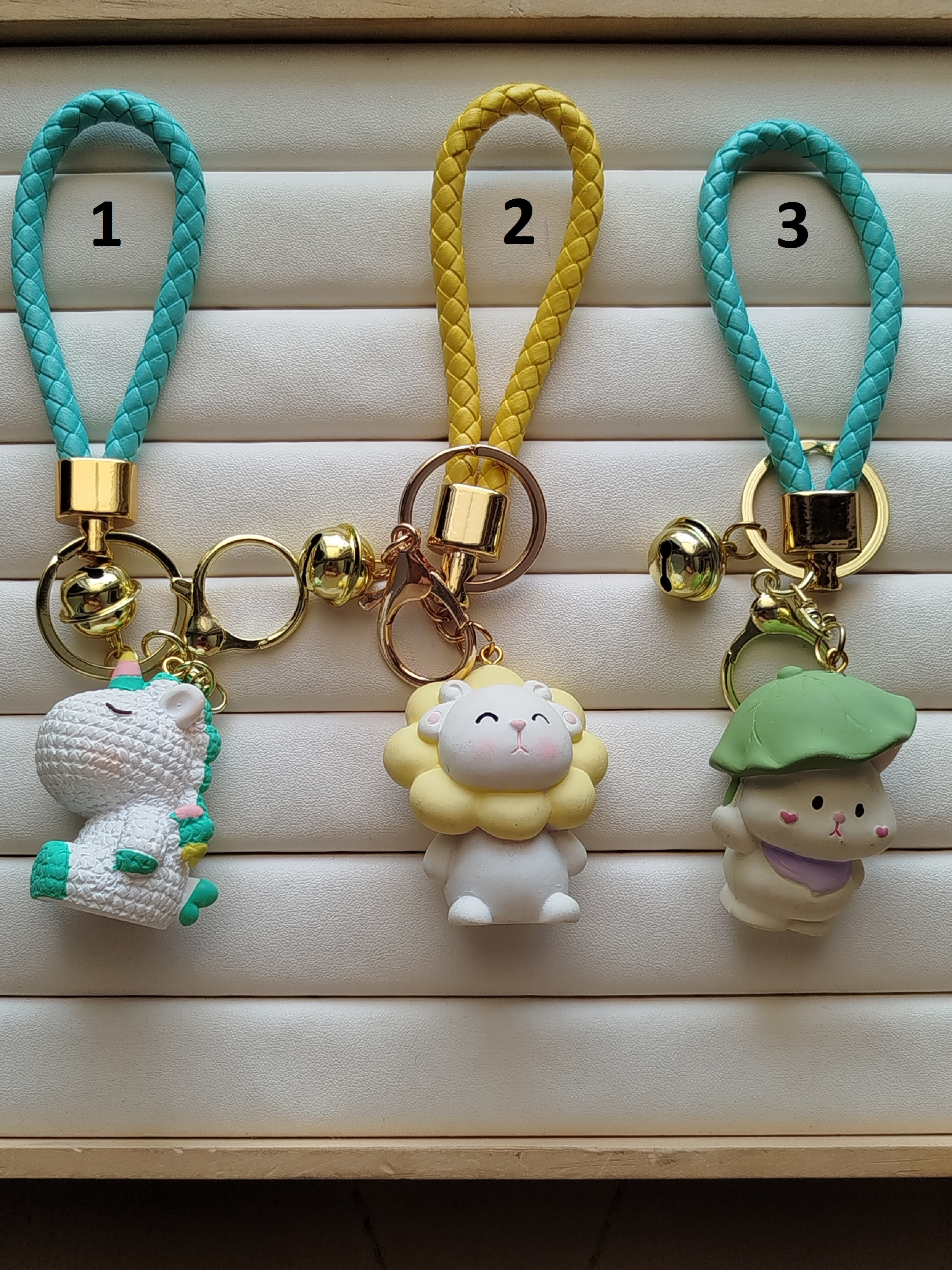 جا کلیدی حلقه طلایی زنگوله دار-بند چرمی کد 14