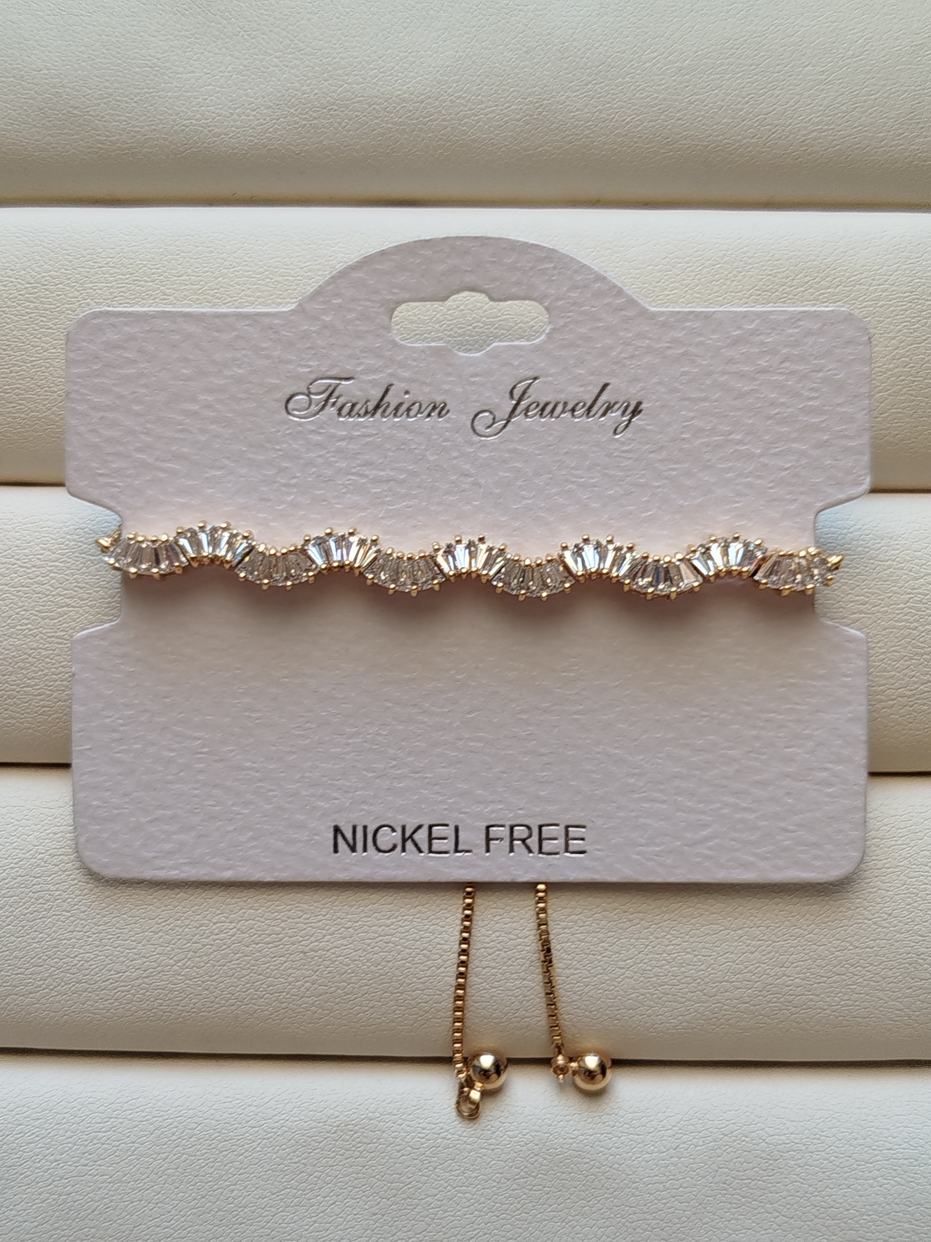 دستبند کراواتی نگین تنیسی  طرح موج رنگ طلایی کد 26